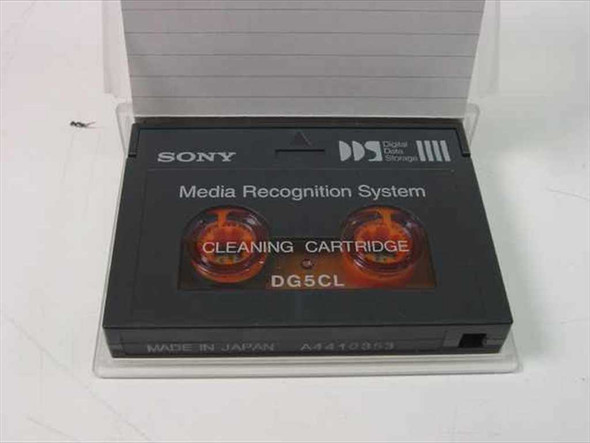 Sony DG5CL DDS Cleaning Cartridge removed from case — top view showing Media Recognition System label, dual tape reels, and Made in Japan marking
