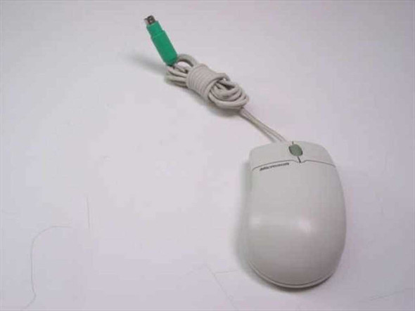 Microsoft IntelliMouse X03-65047 PS/2 trackball mouse – left side view showing light gray body and green PS/2 connector