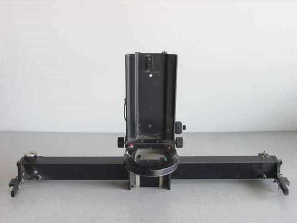 Custom optical apparatus with moveable lens housing on linear slide rail — front view showing full assembly