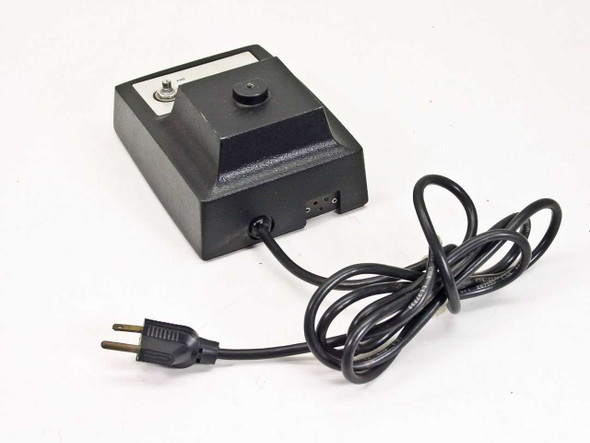 Bausch & Lomb 31-35-28 illuminator transformer – rear three-quarter view showing 4-pin output connector and power cord routing