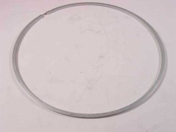 9-inch metal ring clamp flange gasket laid flat on white surface, showing full circular profile