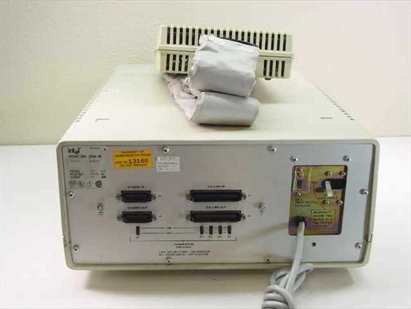 Intel III515 emulator rear panel showing parallel port connectors, power inlet, and wiring with accessories on top