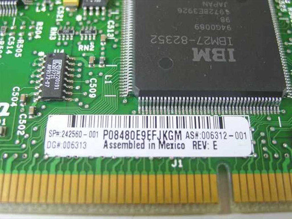 Compaq 242560-001 memory board close-up of label showing SP 242560-001, AS 006312-001, Rev E, IBM 27-82352 controller chip, and Assembled in Mexico markings
