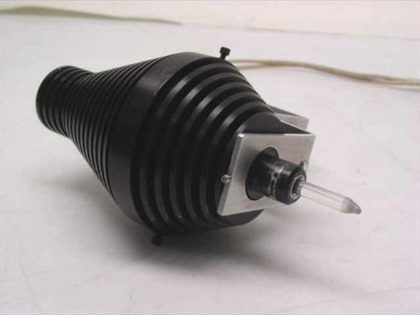Close-up of microscope lamp housing showing ribbed black finned body and protruding bulb tip with metal mounting collar