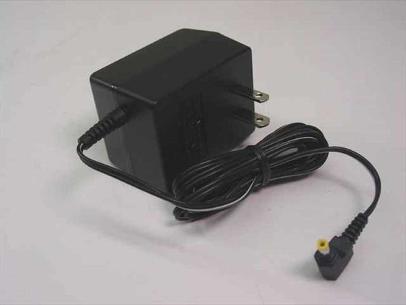 Sony AC-E455 AC power adapter – right-side view showing compact black body, folding US prongs, and output cable with barrel connector