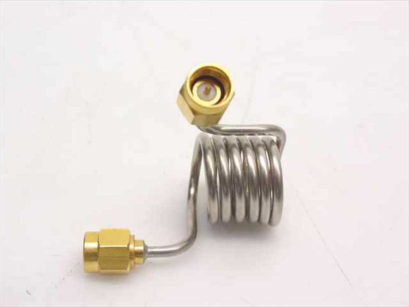Stainless steel coiled coaxial cable SMA male – angled top view showing coil profile and upper SMA connector detail