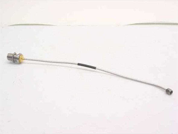 Semi-rigid coaxial cable approximately 11 inches long with N-Female bulkhead connector at left end and SMA-Male connector at right end – full length side view