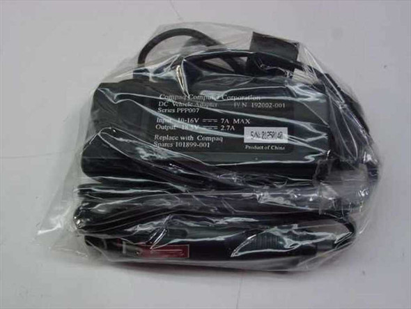 Compaq 192002-001 PPP007 DC Vehicle Adapter in original sealed plastic bag showing unit and cables