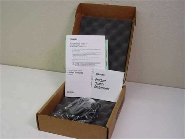 Compaq 192002-001 DC Vehicle Auto Adapter open box with foam insert, documentation booklets, and adapter in bag