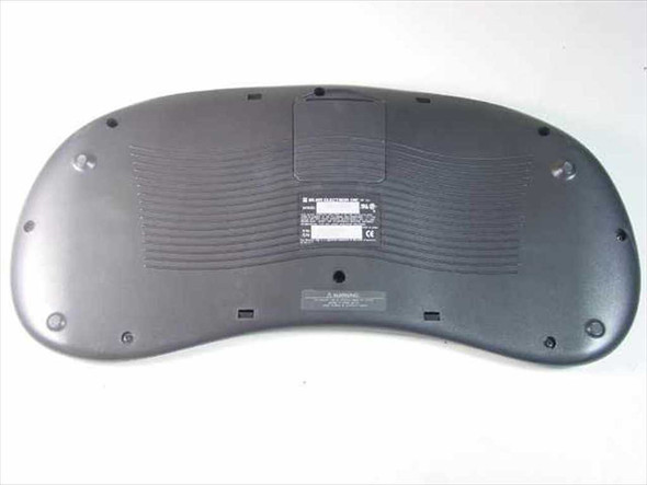 Sejin SWK-8697WT wireless keyboard — bottom view showing battery compartment cover and label area