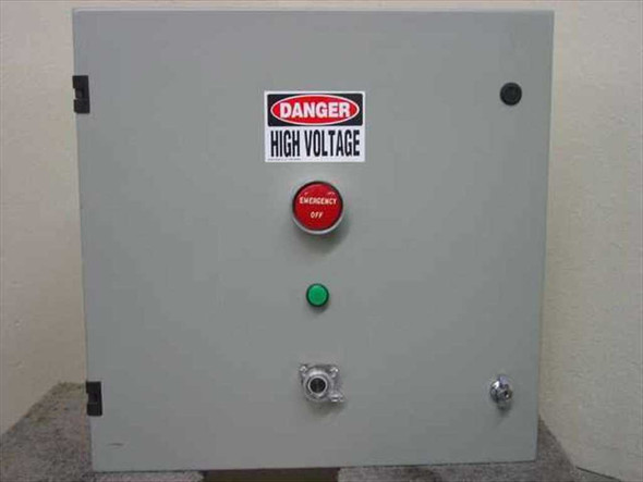 Custom power conditioner enclosure front panel showing DANGER HIGH VOLTAGE label, red Emergency Off mushroom button, green pilot indicator, and key lock
