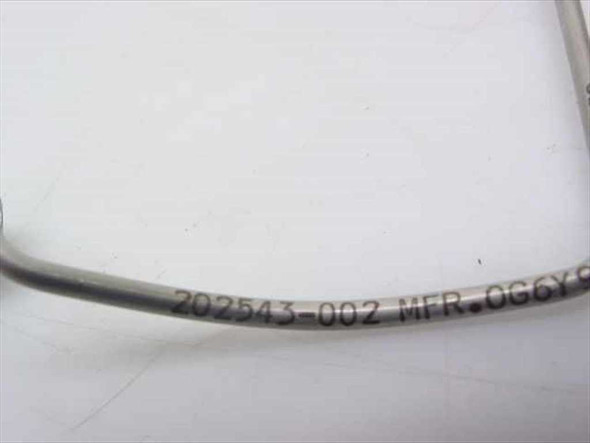 Close-up of cable body stamp reading 202543-002 MFR on the preformed coaxial cable