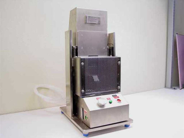 Electro pneumatic punch stainless steel benchtop – front view showing vented enclosure, control panel, and punch column with rubber feet