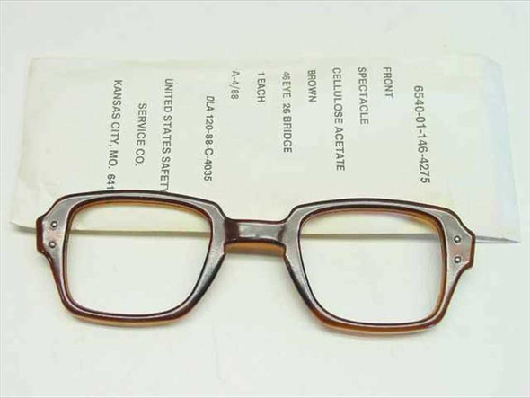 USS 6540-01-146-4275 military spectacle frame front view with original paper sleeve showing NSN and specs