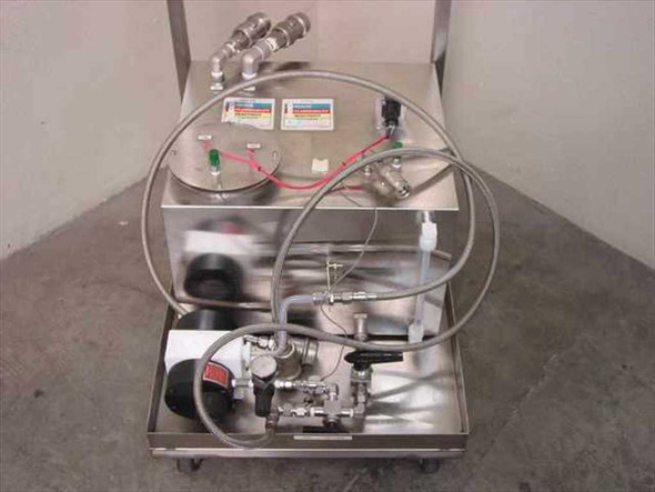 Chemical transport cart front view without handle – stainless tank with integrated pump, valve manifold, and braided flex hose