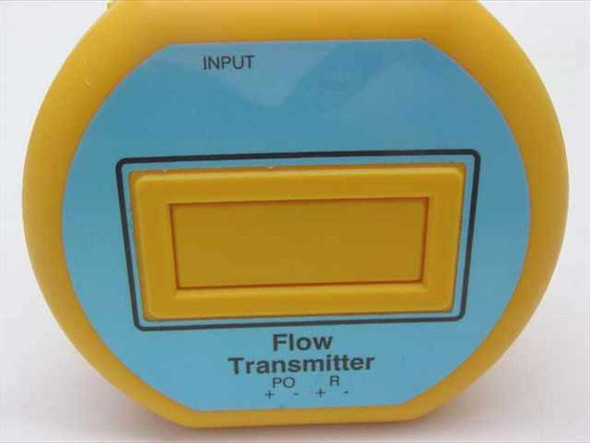 Unbranded Flow Transmitter front face close-up showing INPUT label at top, rectangular indicator panel, and PO R plus/minus adjustment markings