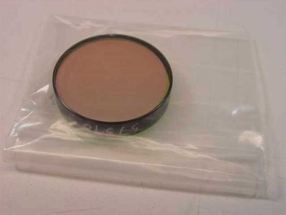 Oriel 57570 narrowband bandpass filter disc in clear plastic bag, 1-inch diameter, orange-tinted glass element