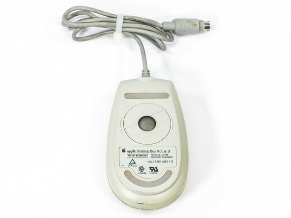 Apple Desktop Bus Mouse II M2706 – bottom view with label showing Family No. M2706, FCC ID BCGM2706, assembled in Malaysia