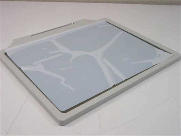 Spectrum GRX-17 Glass Glare Screen rear view showing protective plastic film still attached to glass surface with peel tabs visible
