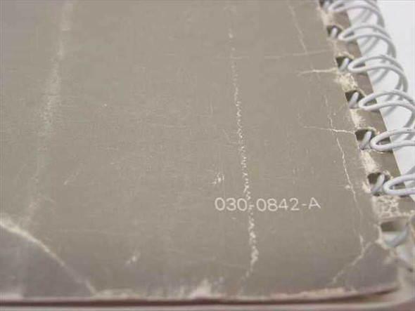Apple AppleWorks Tutorial Manual 030-0842-A back cover showing part number 030-0842-A printed on worn gray cover with spiral binding
