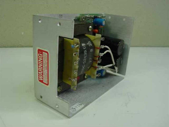 ACDC Electronics 24N3.6 power supply interior side view showing transformer, filter capacitors, and regulation PCB with WARNING label on chassis