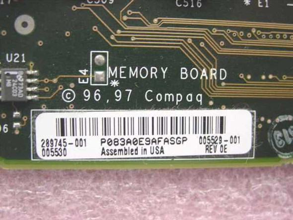 Compaq 289745-001 Memory Expansion Board label closeup showing part number 289745-001, secondary P/N 005529-001, Rev 0E, assembled in USA, copyright 1996/97 Compaq