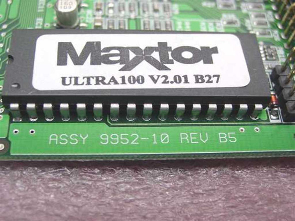 Close-up of Promise Ultra100 board showing Maxtor BIOS chip labeled Ultra100 V2.01 B27 and PCB silkscreen reading ASSY 9952-10 REV B5
