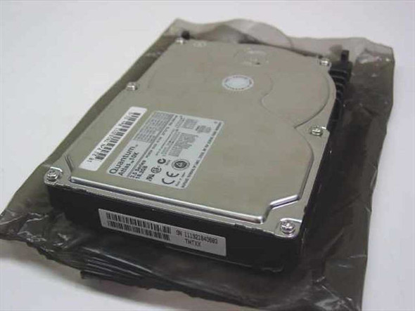 Quantum Atlas 10K TN18J011 18.2GB 3.5-inch 80-Pin SCSI hard drive shown in anti-static bag, top label visible with Quantum branding and CE marking
