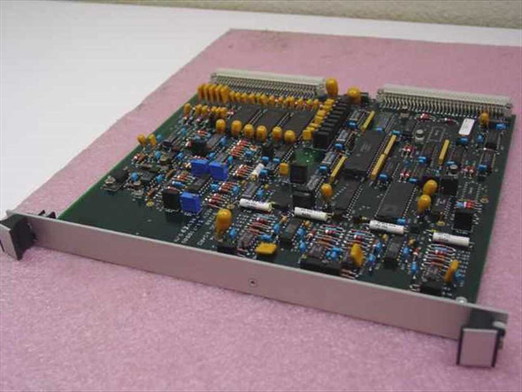 Analog Devices 31-710009-001 Analog Board – angled top view showing full PCB with card-cage bracket, yellow tantalum capacitors, and multiple ICs