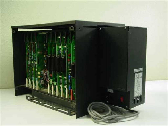 Isoetec EZ-1/96 12100 PBX system open chassis showing populated card cage with multiple green circuit boards and integrated power supply unit with power cord