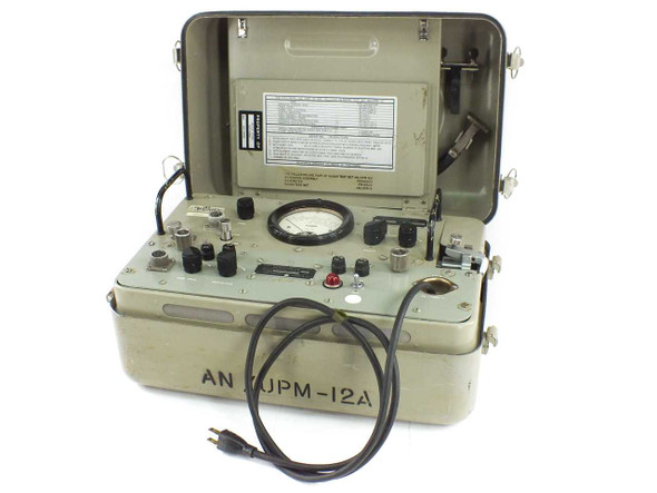 AN/UPM-12A VSWR test set open in carry case showing front panel and power cord, case stenciled AN/UPM-12A