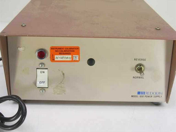 Rudolph Model 600 Power Supply – front panel close-up showing ON/OFF rocker switch, red pilot light, Normal/Reverse toggle, calibration sticker, and brand label