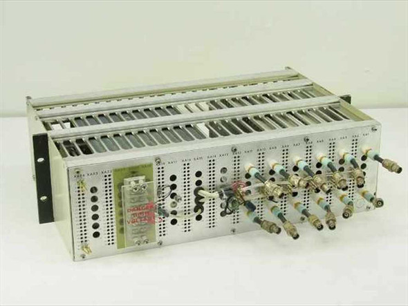 Quintron Systems rackmount FM modulator chassis front-left view showing three modulator cards with BNC and banana jack connectors installed, and DANGER HIGH VOLTAGE label visible on backplane