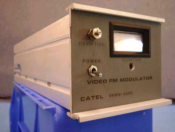 Catel VFMM-2000 Video FM Modulator front panel showing Deviation control knob, Power toggle switch, analog Deviation meter, and engraved CATEL VFMM-2000 label