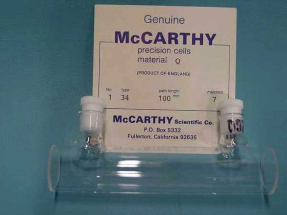 McCarthy Scientific Type 34 Precision Cell Material Q — front view showing labeled card: No. 1, Type 34, 100mm path length, matched 7, product of England, with two white-capped optical cells in holder