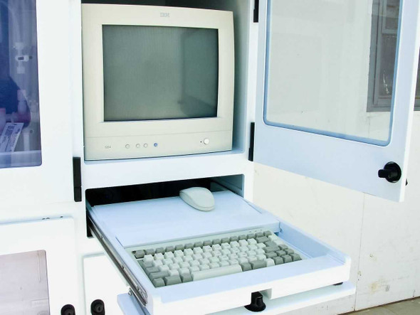 Parker Technologies PS2000 – internal IBM PC controller compartment showing CRT monitor, keyboard, and mouse on slide-out tray