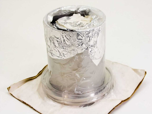 MDC Vacuum 820001 L400-1 LF Clamp wrapped in foil protective packaging, top view