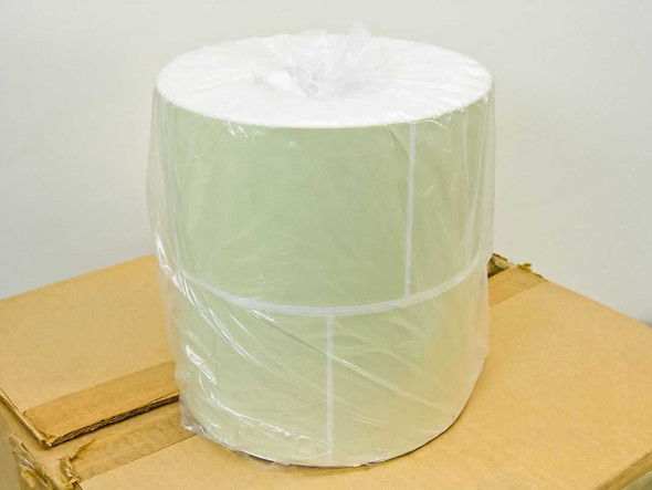 Intermec 050469 thermal label roll — single large roll in plastic wrap sitting on top of shipping box