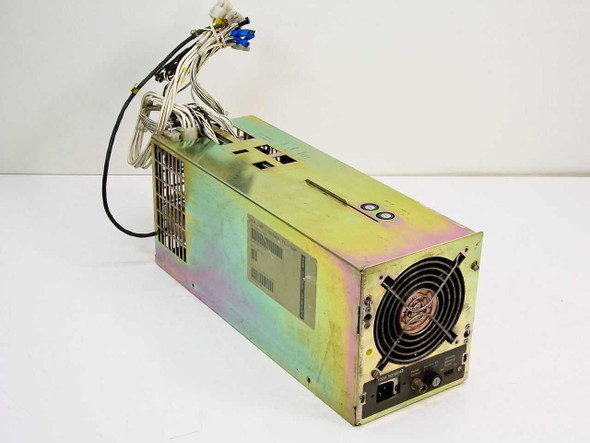NCR 530-0009297-1 mainframe power supply – front-left three-quarter view showing iridescent zinc-plated steel chassis and output wire harness