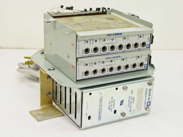 Rockwell 8548-00 Power Supply with two Wescom 401 Wire Line Amplifier modules stacked on top — front and top view showing BNC jacks and panel labels