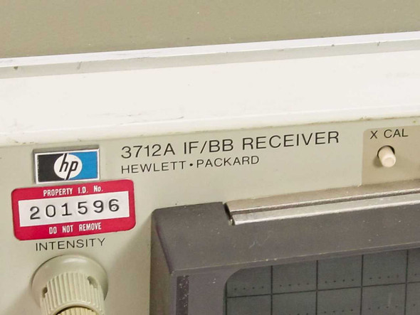 HP 3712A IF/BB Receiver label close-up showing model number and Hewlett-Packard branding, with property ID tag 201596