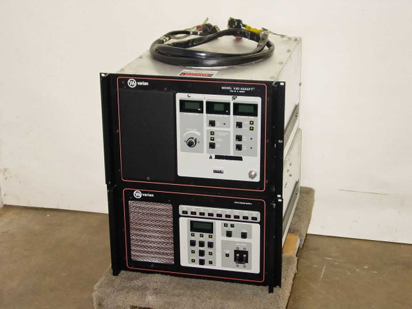 Varian VZC-6965F7 700W C-Band TWTA amplifier stacked with TWTA power supply unit — front view, both chassis on pallet