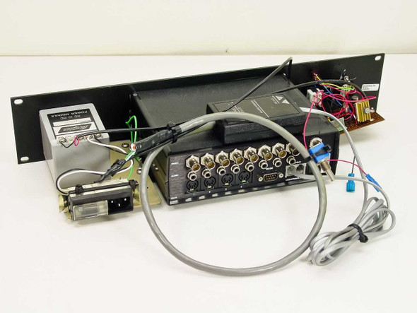 Leightronix Mini-T-Pro rear view showing BNC video connectors, DIN audio ports, RS-232, and Pro-Bus connections with cables attached
