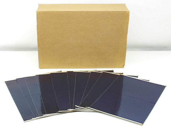 Box of 100 Uni-Solar L-Strip amorphous solar cells shown fanned out in front of original cardboard shipping box