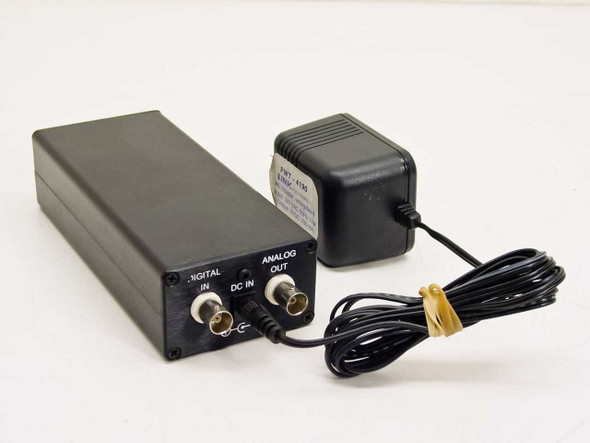 Link Electronics PDA-57 rear panel showing BNC Digital In, BNC Analog Out, and DC In connector, with 9V AC adapter alongside