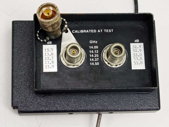 Varian 01000281-00E RF Input Module front panel closeup showing 'CALIBRATED AT TEST' label, dual TNC connectors, calibrated dB and GHz frequency table (14.00–14.50 GHz), and SMA adapter