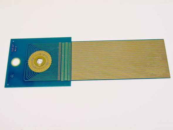 110-147C Rev G DAS Device PCB front view showing teal board with gold finger flex ribbon extending right and radial gold contact array on left