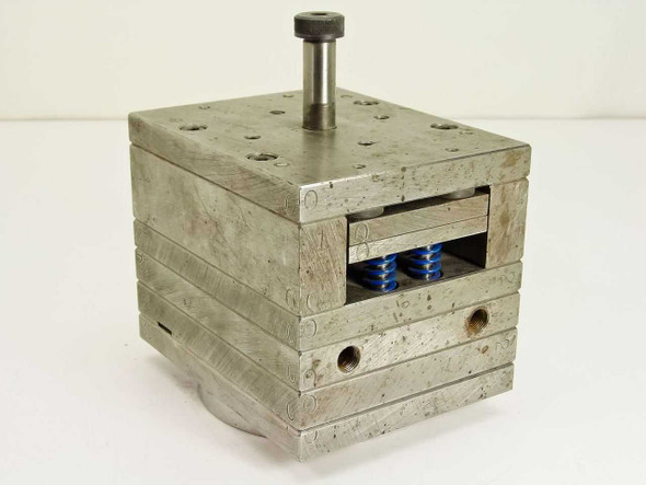 Spring Loaded CD Disk Inner Torsion Unit 20725 – front-left three-quarter view showing blue compression springs and laminated stainless steel plate stack