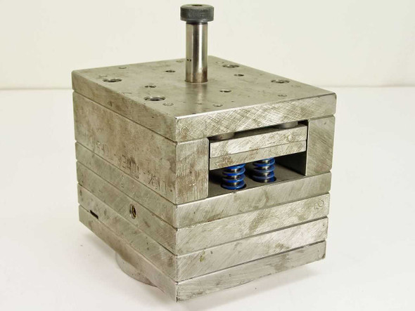 Spring Loaded CD Disk Inner Torsion Unit 20725 – front-right three-quarter view showing stainless steel laminated body and two blue torsion springs in open slot