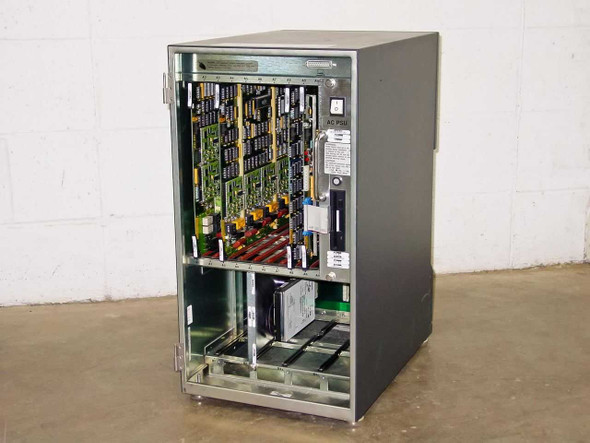 Octel VMX200 voicemail system – three-quarter front view showing open card cage with populated circuit boards and lower drive bays